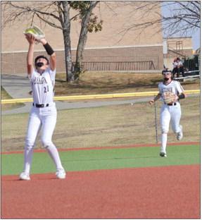 SHORTSTOP BELLA LOEFFERT catches a pop-up as outfielder Kinley Rogers runs in to back her up Oct. 11 at Excelsior Springs. DUSTIN DANNER | Staff