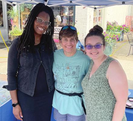 TRIVEECE PENELTON, Laurie Brown and Becca Pruett attend Waterfest and poll residents on flood issues in downtown Excelsior Springs. BRIAN RICE | Staff