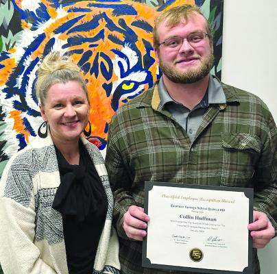 ESSD ASSISTANT SUPERINTENDENT Dr. Melissa Miller (left) recognizes Collin Huffman as employee of the month for his dedication to the district. Submitted