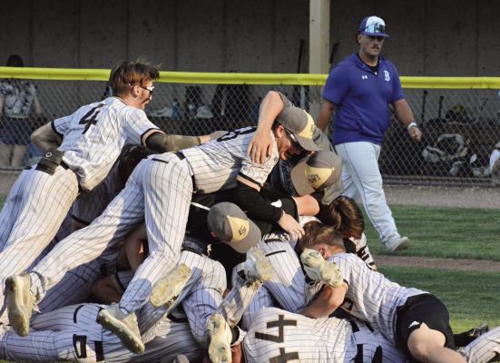 MEMBERS OF THE Excelsior Springs varsity baseball team dogpile on one another May 25 after the Tigers win their Class 4 state quarterfinal meeting with Boonville at Harley Park-Oscar Twillman Field. SHAWN RONEY | Staff