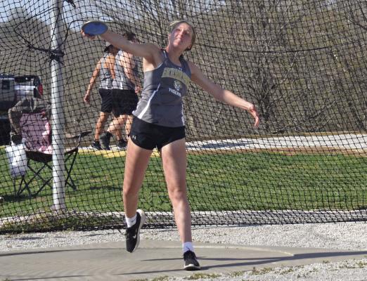 KINLEY ROGERS, a first-year high schooler, attempts a discus throw during the Highway 92 Meet April 13 at Tiger Stadium. DUSTIN DANNER | Staff