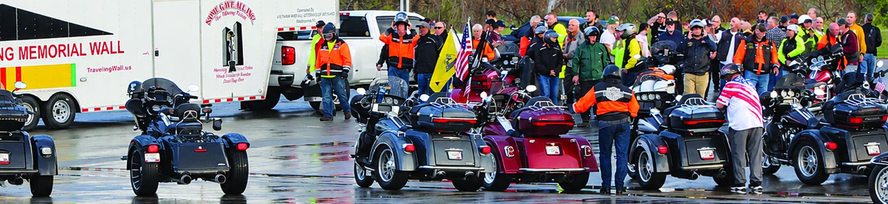 Escort honors Memorial Wall