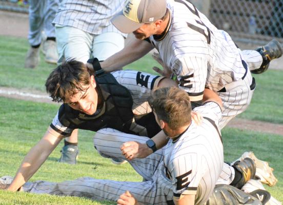 AFTER DEDICATING MORE than three decades to the students and athletes of Excelsior Springs, high school teacher and coach Aaron Holst has announced his retirement. He is pictured above (No. 44) in a dogpile after winning a baseball game in 2023. SHAWN RONEY | Staff