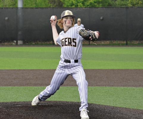 COOPER COLLINS helps Excelsior Springs get Aaron Holst his 300th coaching victory by pitching in relief against Raytown April 28 at Tiger Stadium.