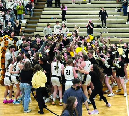 STUDENTS AND families storm the court after the ESHS girls’ basketball team becomes district champions. MIRANDA JAMISON | Staff