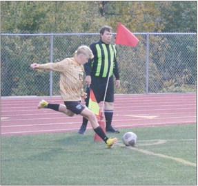 DUSTIN DANNER | Staff KOLIN KINCAID takes a corner kick Oct. 12 against visiting NKC.