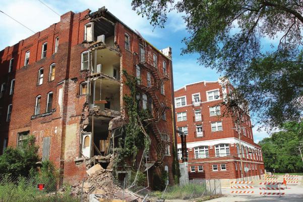 THE ROYAL HOTEL, left, stands across Marietta Street from The Oaks senior apartments, a downtown renovation success. What remains of The Royal after demolition this week might be restored, Excelsior Springs Economic Director Melinda Mehaffy says. J.C. VENTIMIGLIA | Staff