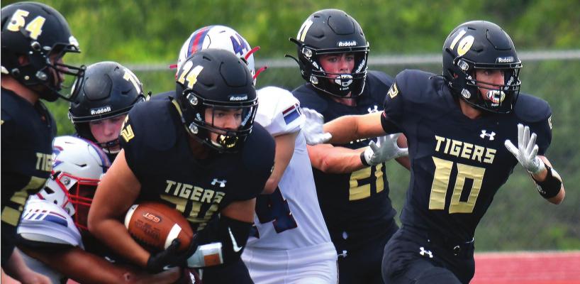 DUSTIN DANNER | Staff JUNIOR AMANI ROBINSON fights through a tackle for Excelsior Springs on his way to a team-leading 73 yards rushing Sept. 12 against visiting Moberly.
