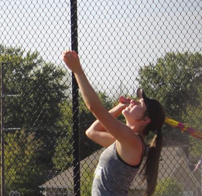 SHELBY STODDEN serves the tennis ball to the Kearney Bulldogs.