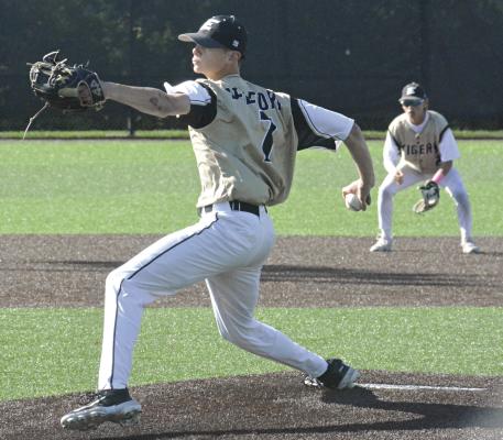 KAELAND BEDFORD delivers a pitch as shortstop Landon Clark stands ready behind him during Excelsior Springs’ 10-0 victory in six innings Monday over visiting Oak Grove. SHAWN RONEY | Staff