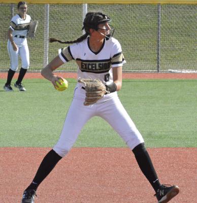 REESE RYAN (right), shown setting to throw during a game last season, returns for Excelsior Springs in varsity softball. SHAWN RONEY | Staff