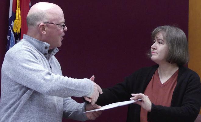 EXCELSIOR SPRINGS Mayor Mark Spohn (left) shakes hands with Sonya Morgan, councilwoman, after presenting her with a proclamation citing October 15-21 Businesswomen in Missouri Week. ELIZABETH BARNT | Staff