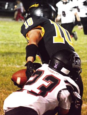 ORRICK SENIOR Parker Floyd (left) fights to get through would-be tackler Levi Hanska of Northland Christian. SHAWN RONEY | Staff