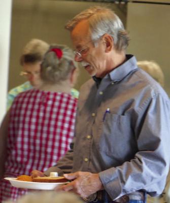 Art Williams is ready to enjoy a hot meal. ELIZABETH BARNT | Staff
