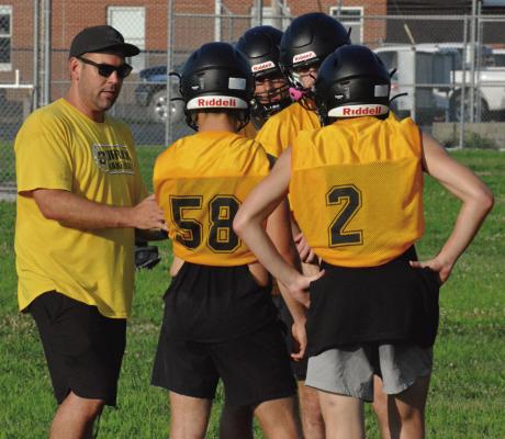 NEW ORRICK VARSITY eight-man football coach Matt O’Dell calls a play for his Bearcats the first day of team camp as they learn his new offense. SHAWN RONEY | Staff