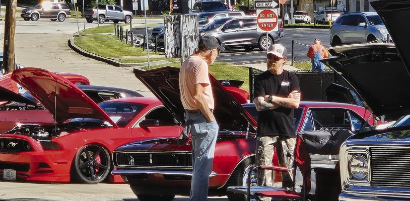 CAR ENTHUSIASTS CHECK out the lineup at the 11th annual car show hosted by Excelsior Springs American Legion Post 236. Proceeds from the event benefit the post and local veterans. MIRANDA JAMISON | Staff