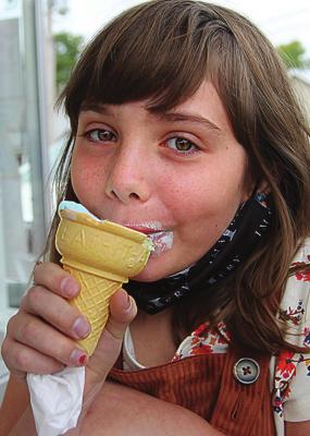 FROM A NEW generation of Dari B customers on the east side of Excelsior Springs, Sylvia Linard, 9, makes short work of an ice cream cone. “I Iove it,” she says. “It’s cotton candy.” J.C. VENTIMIGLIA | Staff