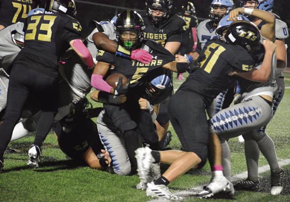 NICK MUBANGA (center) is tough to tackle in varsity 11-man football. That toughness would serve him well on a pickleball court. SHAWN RONEY | Staff
