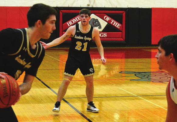 JUNIOR GANNON WILLIS, holding the ball, finishes as the Tigers’ rebounding leader. Senior Tanner Phillips, No. 21, leads in scoring and three-pointers. DUSTIN DANNER | Staff