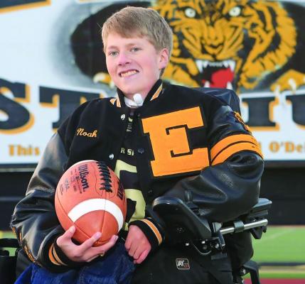 Stadium. Noah Marker wears his letterman jacket in front of the Excelsior Springs Tiger MARKER FAMILY | Submitted