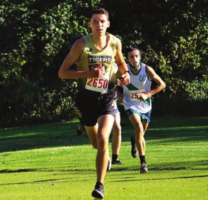 JUNIOR TYLER RUMORE paces the Tigers Oct. 6 at the Excelsior Springs Cross Country Invitational. PROVIDED COURTESY OF TIM HARLAN