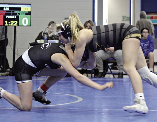 SOPHOMORE LILLAH SHUE (right) snaps down her opponent and prepares for a takedown during Jan. 19 tournament action at Brookfield. DUSTIN DANNER | Staff