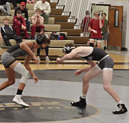 CAYDEN CLEVENGER (left) looks to set up a shot against Maysville’s Casey Berry during Excelsior Springs’ Dec. 5 home quadrangular. DUSTIN DANNER | Staff