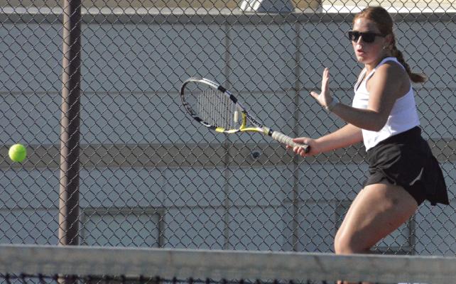 OLIVIA DEERE looks to hit a forehand shot during Excelsior Springs’ varsity girls tennis dual with Kearney. SHAWN RONEY | Staff