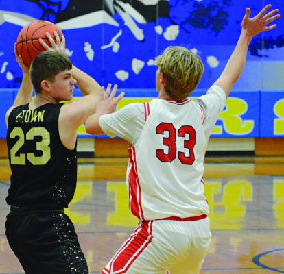 FANS OF the prep teams at Excelsior Springs and Richmond, shown competing in varsity boys basketball, probably won’t have to worry about the Tigers and Spartans border hopping for new facilities. SHAWN RONEY | Staff