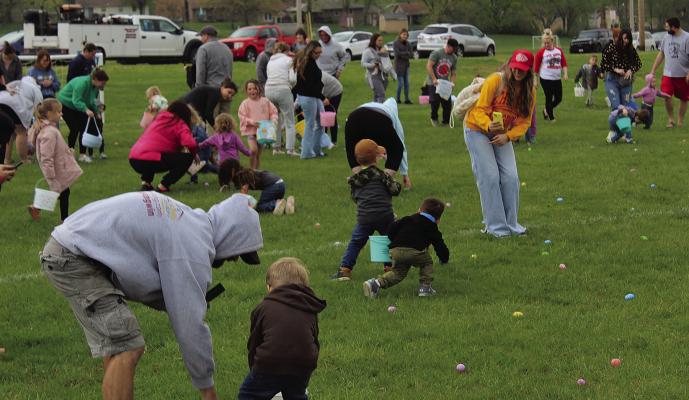 LOCAL CHILDREN chase after as many eggs as they can find. MIRANDA JAMISON | Staff