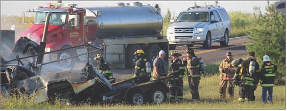 WOOD HEIGHTS, Excelsior Springs and Lawson Fire Departments work together to extinguish flames on the burning vehicles after a fatal head-on collision. MIRANDA JAMISON | Staff