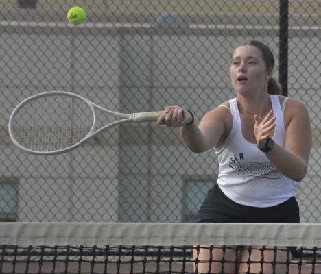 SENIOR LANEY SMITH attempts a forehand shot near the net during Excelsior Springs’ varsity girls tennis dual with Raytown South. SHAWN RONEY | Staff