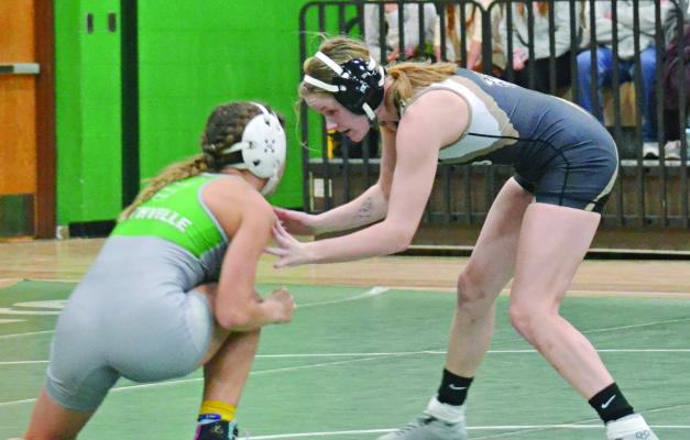 EXCELSIOR SPRINGS senior Jaylenn Hudlemeyer (right) fends off a shot during her match as part of a Jan. 3 dual at Smithville. DUSTIN DANNER | Staff
