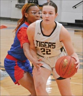 DUSTIN DANNER | Staff past a Kansas City Southeast defender en route to scoring for Excelsior JOSIE CASLER (right) dribbles Springs during a home win.