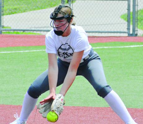 BELLA LOEFFERT follows a ground ball into her glove while taking reps at shortstop during the Excelsior Springs softball camp for grades 7-12 Tuesday at Miracle Field. The camp was scheduled to conclude Thursday. SHAWN RONEY | Staff