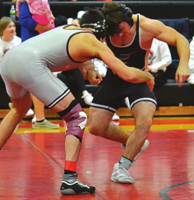 JONAH COWDEN of Excelsior Springs works to get the inside position on his opponent en route to a third-place finish Jan. 29 at the Odessa Invitational. DUSTIN DANNER | Staff