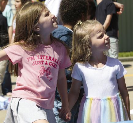 FINLEIGH (LEFT) AND Nova Paige wait for their turn to slide. MIRANDA JAMISON | Staff