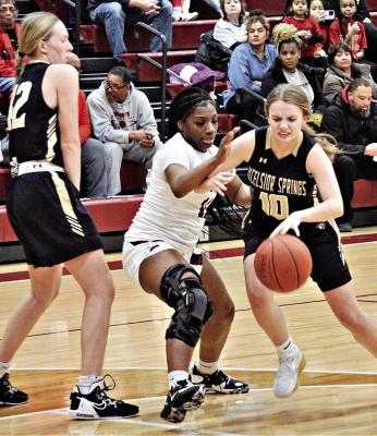 ABBY RASH dribbles off a pick from Kinley Rogers during the Tigers’ Jan. 12 road loss to Winnetonka. DUSTIN DANNER | Staff