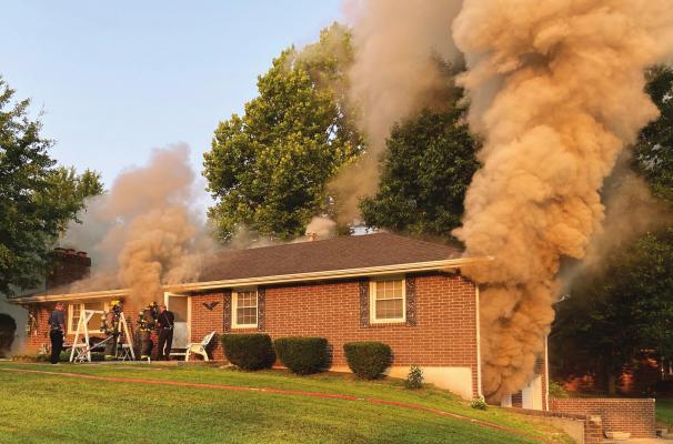 SMOKE pours from this residence, mainly from the lower-level garage, at 7:10 a.m. Aug. 4 at 124 Carla St. because of an accidental basement fire. MIRANDA JAMISON | Staff affiliate