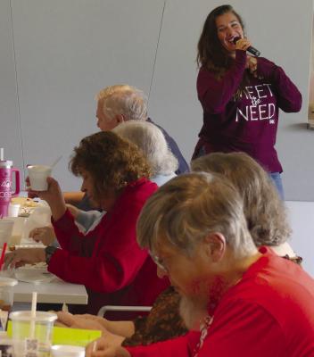 MEET THE NEED and Opportunity Café Director Valerie Hoffecker asks a packed house at the Senior Center if anyone is interested in making donations to this year’s Christmas store. ELIZABETH BARNT | Staff