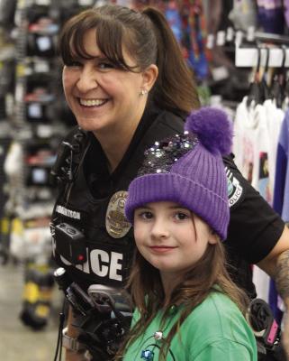 ESPD OFFICER Jo Robertson (left) shops for clothing with Joleen S. MIRANDA JAMISON | Staff