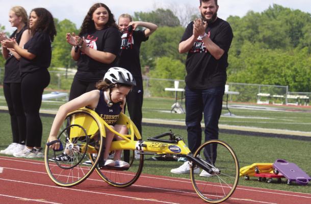 LILLY MORGAN wins the wheelchair race with no competition in sight. MIRANDA JAMISON | Staff