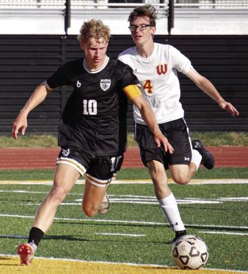 KOLIN KINCAID (No. 10) gets past a defender on the way to scoring one of his four goals in Excelsior Springs’ Sept. 4 tournament win over Winnetonka. DUSTIN DANNER | Staff