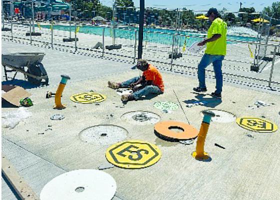 SKYVUER IMAGERY, COURTESY OF JESSE HALL | Submitted CONSTRUCTION WORKERS are finalizing the spray pad fixtures for the outdoor pool.