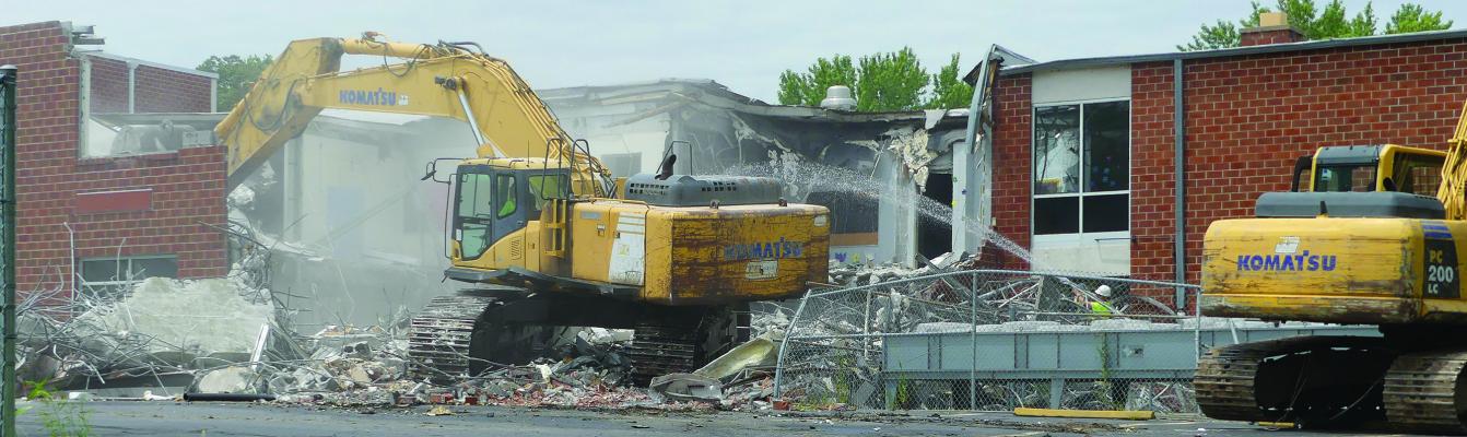The back of Lewis Elementary school is torn down one room at a time. ELIZABETH BARNT | Staff