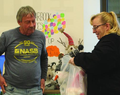 JACINDA WIESE (right) speaks with Glen Bagley about the products from Decorations by Debbie. MIRANDA JAMISON | Staff