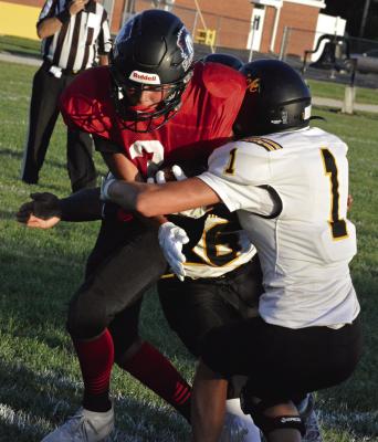 ORRICK JUNIOR Stryker McNary (right) assists in making a tackle during the Bearcats’ jamboree-opening scrimmage with Northland Christian, a Kansas City-based school. Orrick will see the Trailblazers again Friday, when the teams meet at Simmons Field to kick off the varsity 8-man football season.