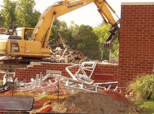 THE REMOVAL of structure wall continues. ELIZABETH BARNT | Staff