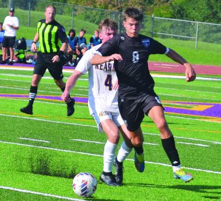 MASON WARTNER, shown here fighting for possession of the ball during a preseason jamboree in August at Kearney, has been among the scorers who’ve helped Excelsior Springs win a third straight district boys soccer title. DUSTIN DANNER | Staff