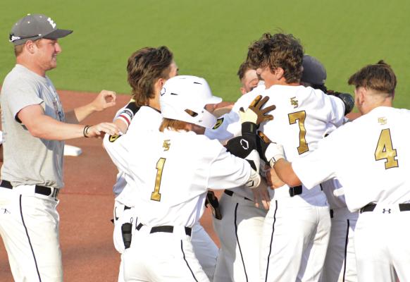 MORE TIGERS storm the ball diamond June 1 at Sky Bacon Stadium to congratulate Kaelan Bedford (No. 7) for his game-winning hit (see related photo on page 6). Those joining in on the celebrating include (far left) Simon Holst, assistant coach; Cooper Collins (No.1); and Brendan Blackburn (No. 4), scorer of the game-winning run. SHAWN RONEY | Staff